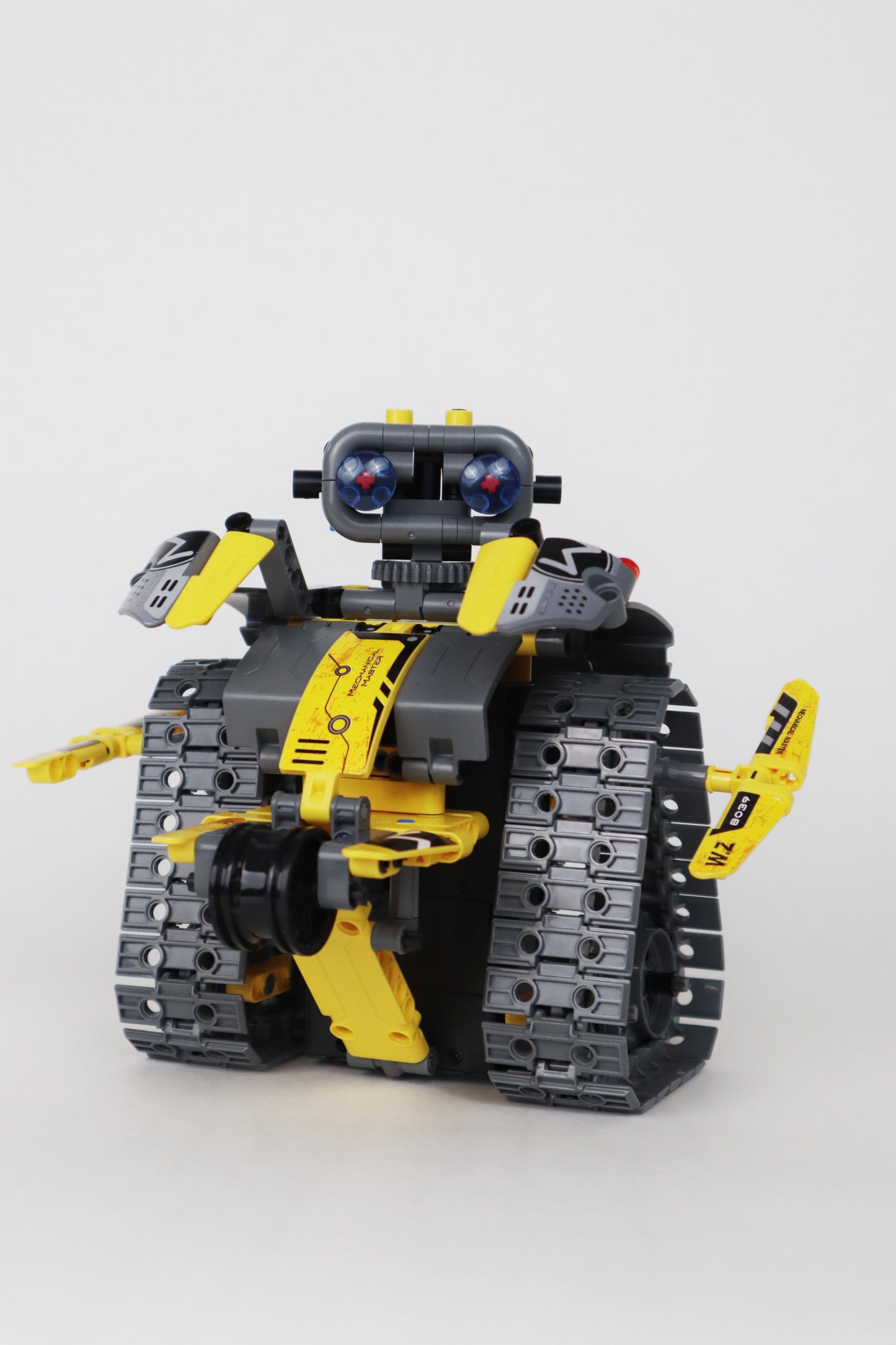 robot dinozaur cu telecomanda building blocks s.t.e.m, programabil 3 in 1, pentru interior si exterior, negru/galben - brainy crafts